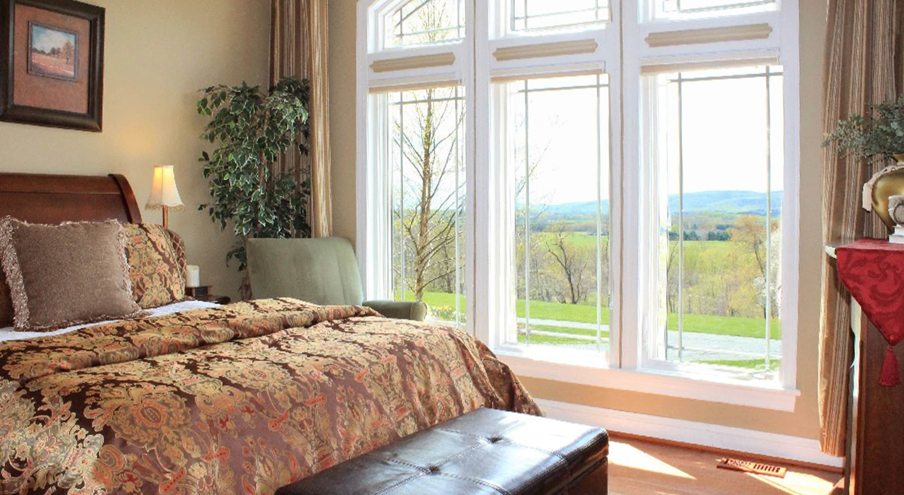 Amity Room bed and view of the grounds at our inn in Northern Virginia