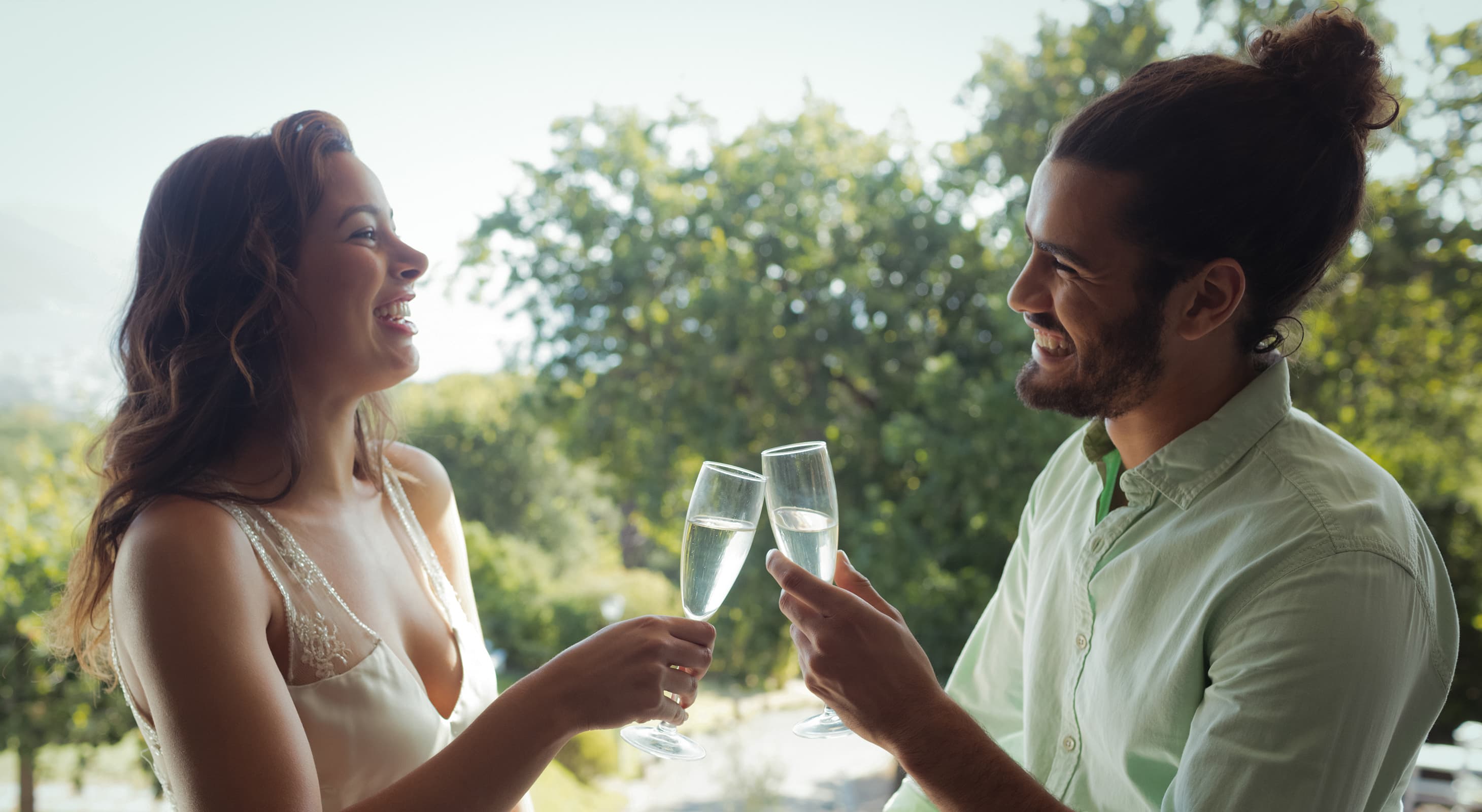 Couple toasting two glasses of Champagne during a getaway in Northern Virginia